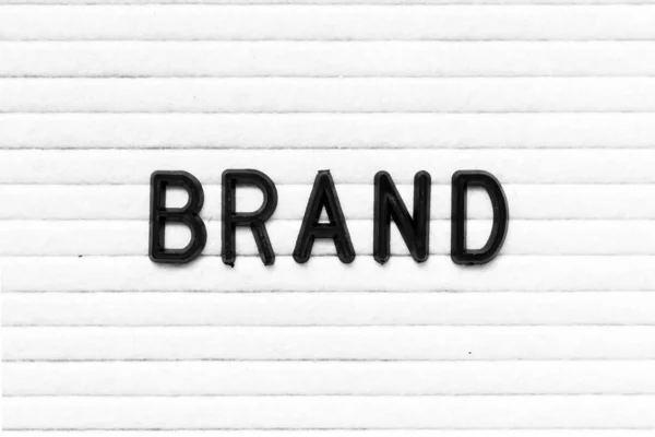 Black Color Letter Word Brand White Felt Board Background — Stock Photo, Image