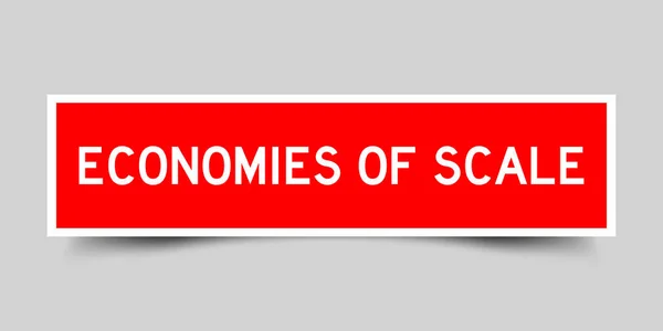 グレーの背景にスケールの赤い色の単語経済とシールラベル — ストックベクタ