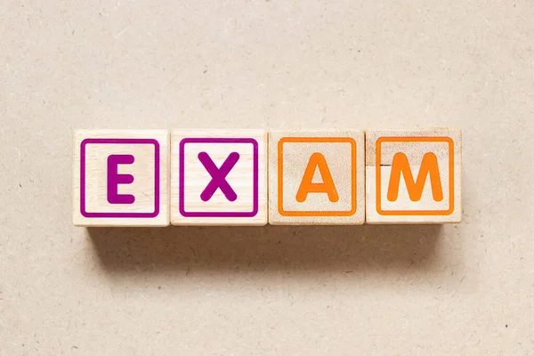 stock image Color letter block in word exam on wood background