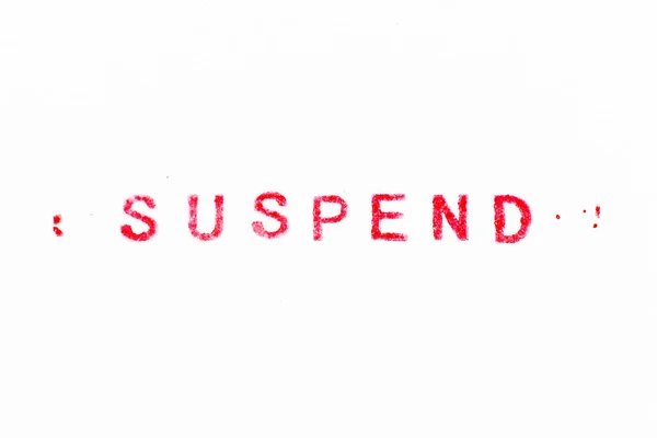 Rote Farbe Tinte Gummistempel Wort Suspend Auf Weißem Papier Hintergrund — Stockfoto