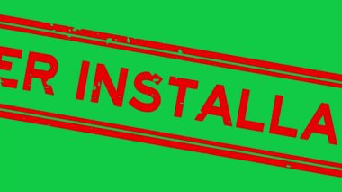 Grunge red under installation word square rubber seal stamp zoom on green background