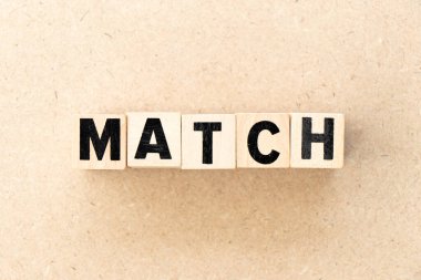 Alphabet letter block in word match on wood background