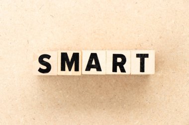 Alphabet letter block in word smart on wood background