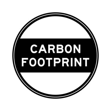 Black color round seal sticker in word carbon footprint on white background