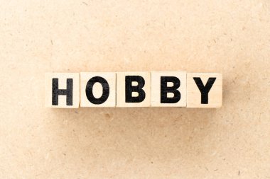 Alphabet letter block in word hobby on wood background