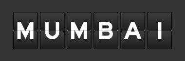 Black color analog flip board with word mumbai on gray background