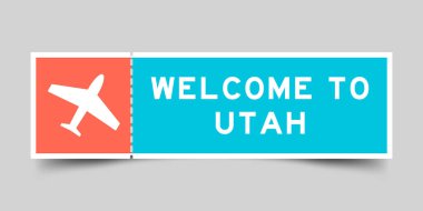 Orange and blue color ticket with plane icon and word welcome to utah on gray background