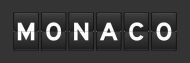 Gri arkaplanda kelime monaco ile siyah renk analog çevirme tahtası