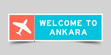 Orange and blue color ticket with plane icon and word welcome to ankara on gray background