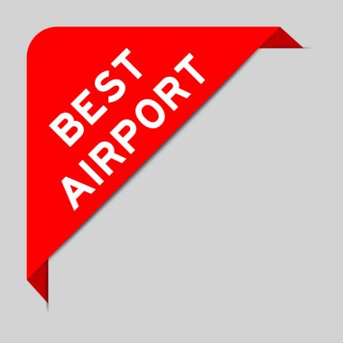 Red color of corner label banner with word best airport on gray background
