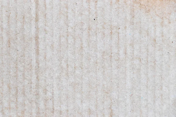 Water stained on brown corrugated packaging material background with copy space, used as wallpaper, decoration, design element, layer effect