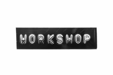 Black color banner that have embossed letter with word workshop on white paper background