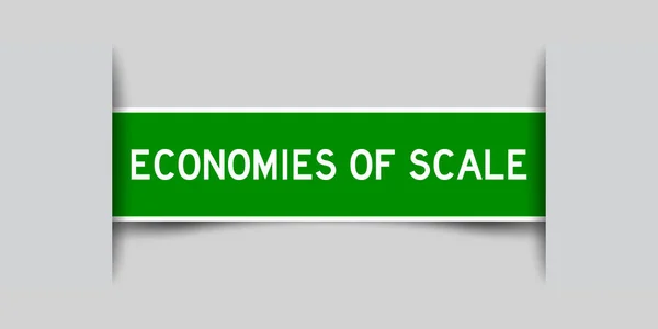 グレーの背景にスケールの単語経済と緑の色のラベルステッカーを挿入 — ストックベクタ