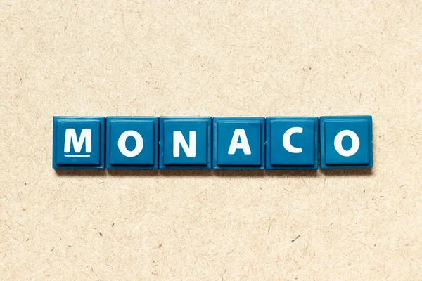Litera Alfabetu Słowie Monako Tle Drewna — Zdjęcie stockowe