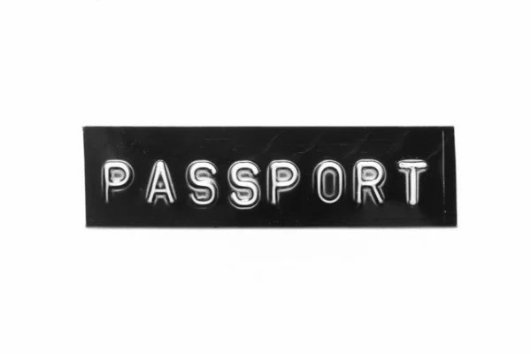白い紙の背景に単語のパスポートと文字をエンボス加工した黒の色のバナー — ストック写真