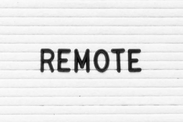 Zwarte Kleur Brief Woord Remote Witte Vilten Bord Achtergrond — Stockfoto