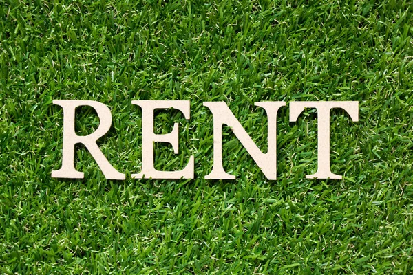 Wood Alphabet Letter Word Rent Artificial Green Grass Background — Stock Photo, Image