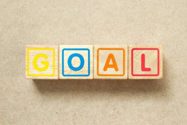 Tahta alfabe harf bloğu tahta arka planda kelime hedefi