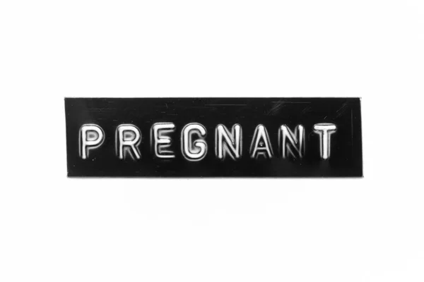 白い紙の背景に妊娠中の言葉で文字をエンボス加工した黒の色のバナー — ストック写真