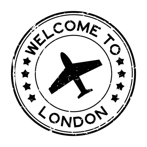 Grunge Svart Välkommen Till London Med Flygplan Ikon Rund Gummi — Stock vektor