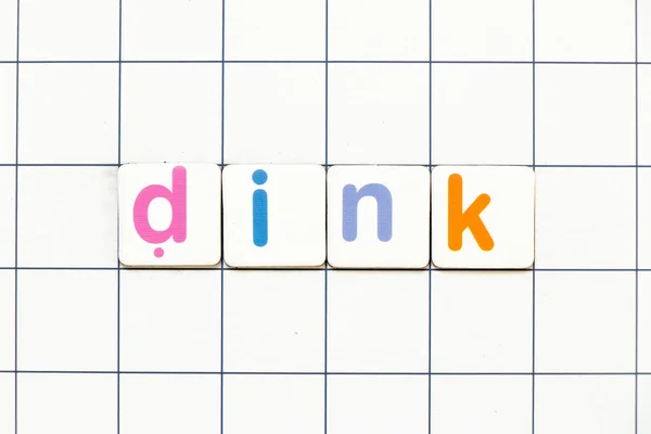 Colorful tile letter in word DINK (Abbreviation of Double income, no kids or Dual income, no kids) on white grid background
