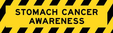 Sarı ve siyah çizgili etiket pankartı ile mide kanseri farkındalığı