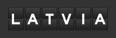 Siyah renk analog ters çevirme tahtası ve gri arkaplanda latvia kelimesi