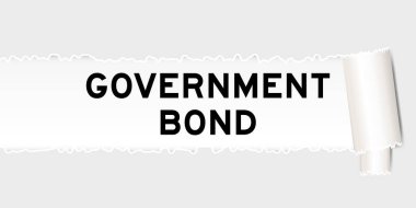 Yırtılmış gri kağıt arka planda yırtılan kısım altında devlet tahvili var