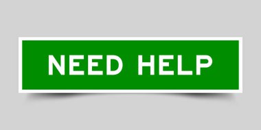 Kare etiketi ile kelime gri arkaplan üzerinde yeşil renk yardıma ihtiyacı var