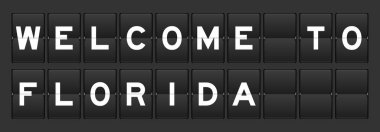 Gri arka planda Florida 'ya hoş geldiniz yazılı siyah renk analog ters tahtası