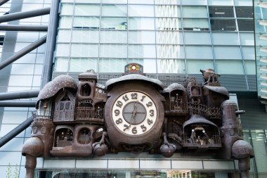 Tokyo, Japan - M1r 30, 2024 : The giant Ghibli clock that located at Nittele Tower (headquarters of Nippon Television) clipart