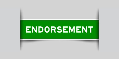 Green color square label sticker with word endorsement that inserted in gray background clipart