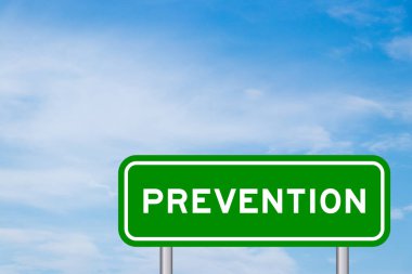 Green color transportation sign with word prevention on blue sky with white cloud background clipart