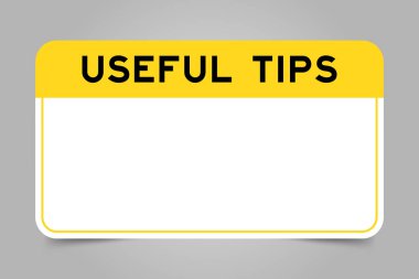 Label banner that have yellow headline with word useful tips and white copy space, on gray background clipart