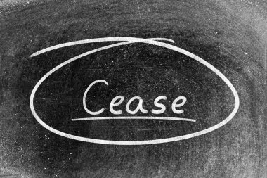 White chalk hand writing in word cease and circle shape on blackboard background clipart