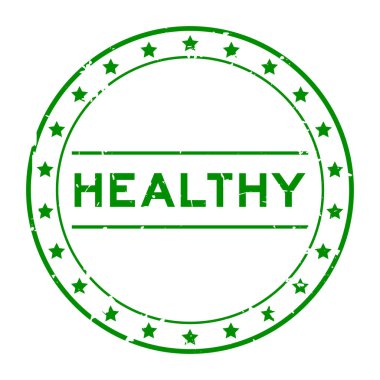 Grunge yeşil sağlıklı kelime yuvarlak lastik mühür beyaz arka planda