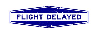 Grunge mavi uçuş gecikmeli kelime altıgen lastik mühür beyaz arka planda