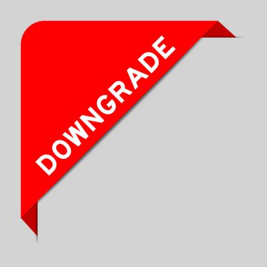 Red color of corner label banner with word downgrade on gray background clipart