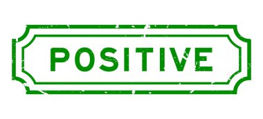 Grunge yeşil kelime pozitif beyaz arka planda lastik mühür