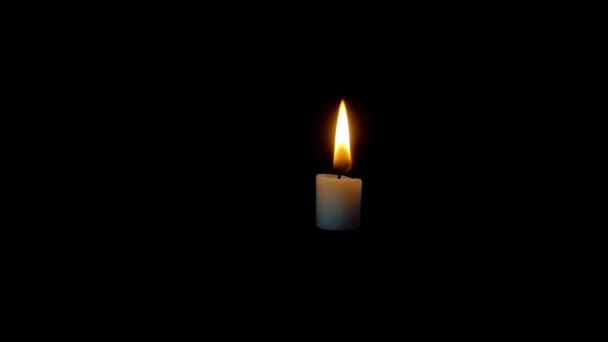 Man Extinguishes Candle Fire Isolated Black Background — Stockvideo