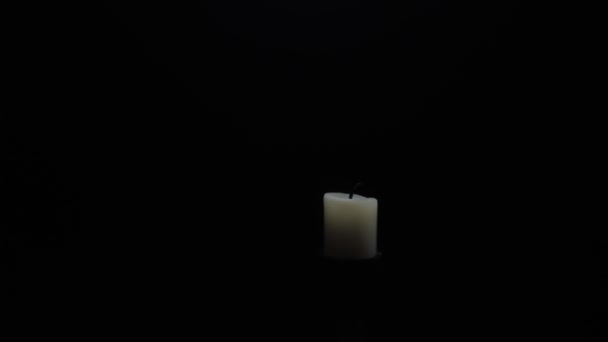 Man Ignites Fire Lighter Candles Isolated Black Background — Stockvideo