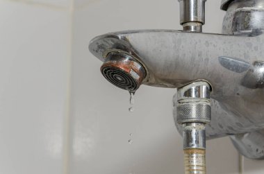 Water flows through the faucet aerator