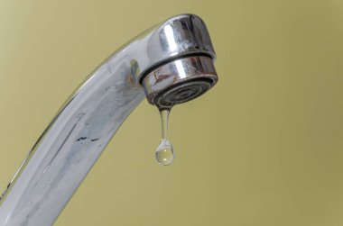 Water flows through the faucet aerator