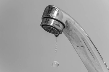 Water flows through the faucet aerator