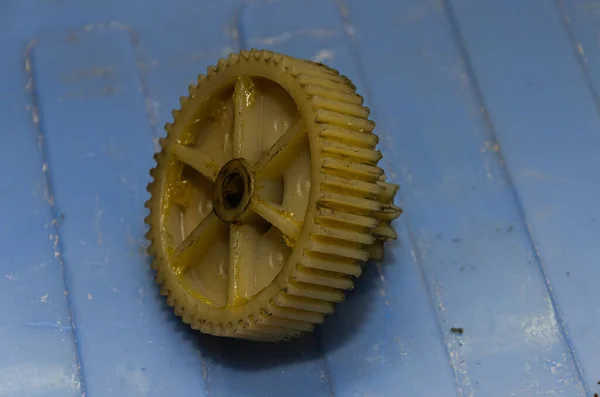 Plastic gears of a disassembled gearbox in a repair shop