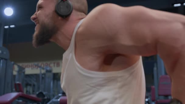 Strong Muscular Bald Man Beard Does Reverse Push Triceps Muscle — Stock Video