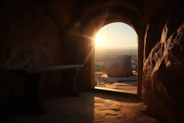 stock image View from an inhabited stone cave with wooden benches. The rays of the spring sun illuminate the stone moat overlooking the Orthodox cross. Religious concept of the bright holiday of Easter