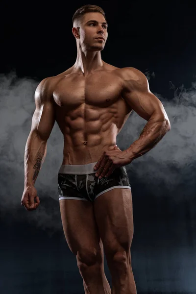 Attractive Sexy Bodybuilder Posing Shorts Studio Black Background Demonstrating Muscular — стоковое фото