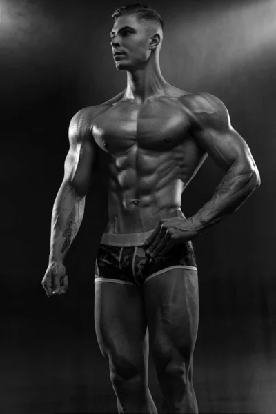Attractive Sexy Bodybuilder Posing Shorts Studio Black Background Demonstrating Muscular — стоковое фото