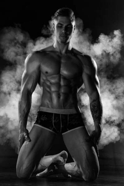 Strong Athletic Man Poses Shirtless Standing Knees Black Studio Athletic — Stock Photo, Image